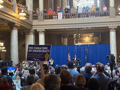 Pete Buttigieg on stage with supporters